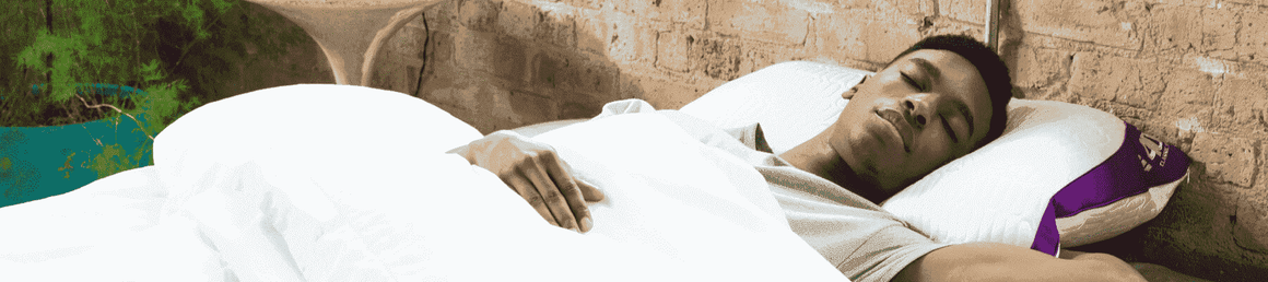 man asleep on ZEEQ smart pillow